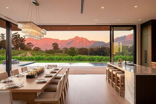 Open-plan lounge and kitchen in a De Heuwelzicht home, Stellenbosch